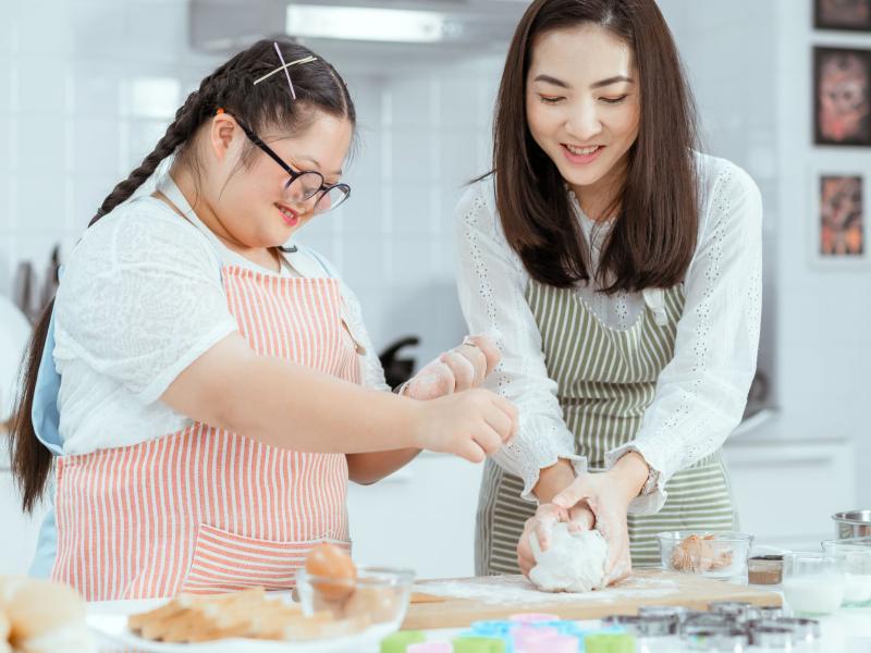 Mom and daughter baking together