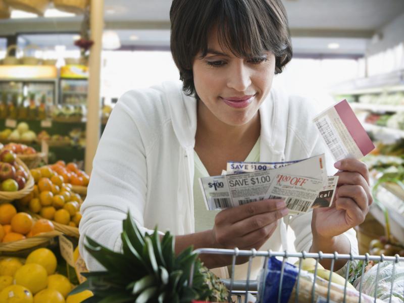 Woman looking at coupons