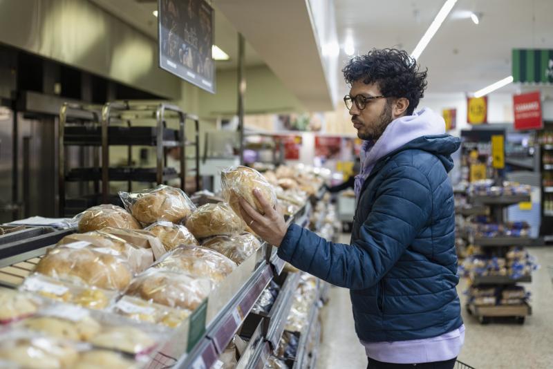 Man picking out bread